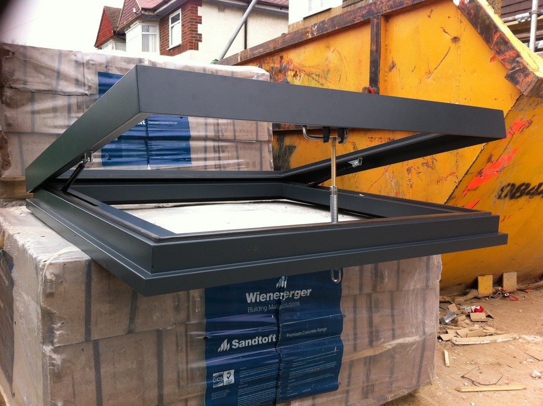 Opening flat roof skylight in anthracite grey installed in Mayfair
